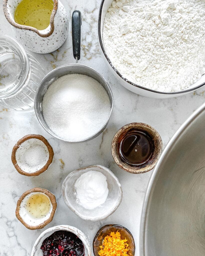 ingredients for blackberry orange cupcakes measured out against white marble surface