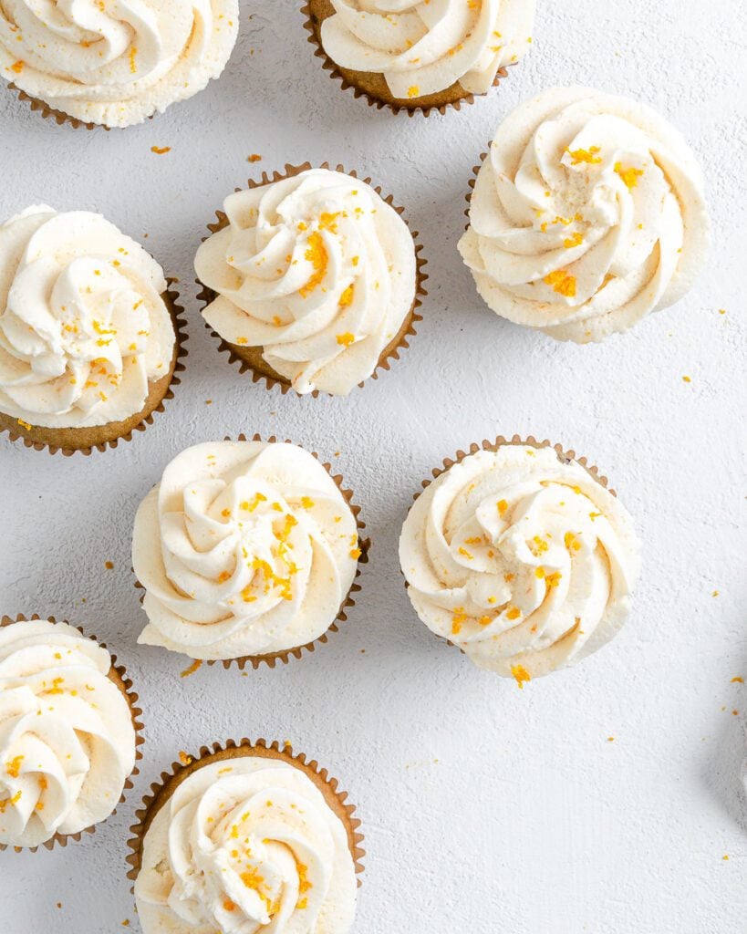 completed Blackberry Orange Cupcakes displayed on a white surface with a top view