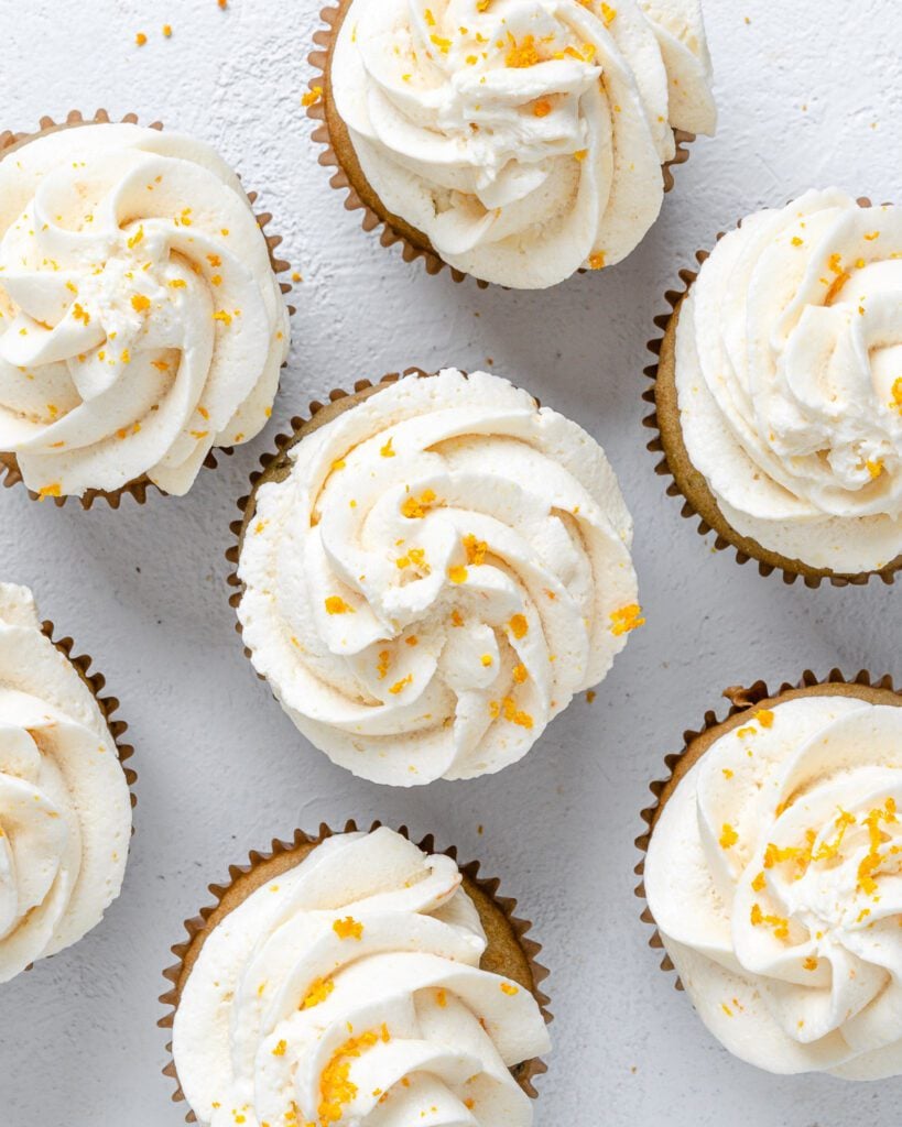 completed Blackberry Orange Cupcakes displayed on a white surface with a top view