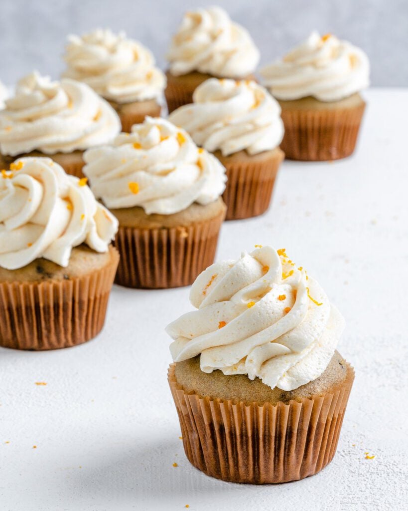 completed Blackberry Orange Cupcakes displayed on a white surface