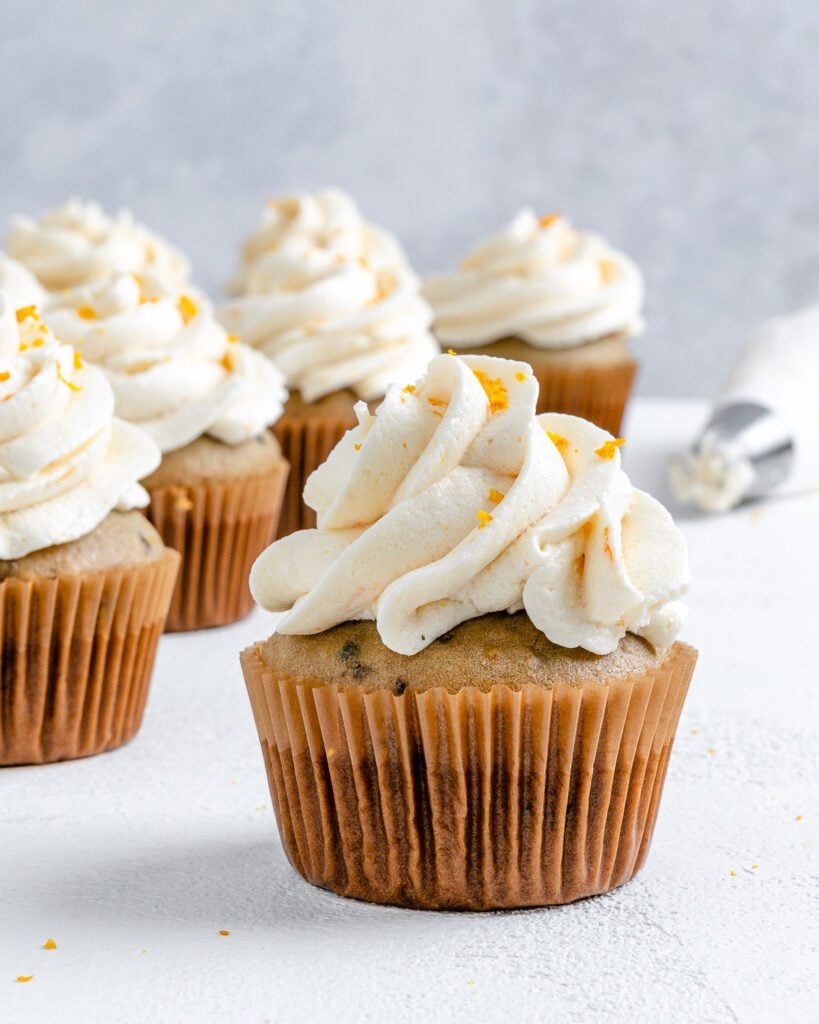 completed Blackberry Orange Cupcakes displayed on a white surface