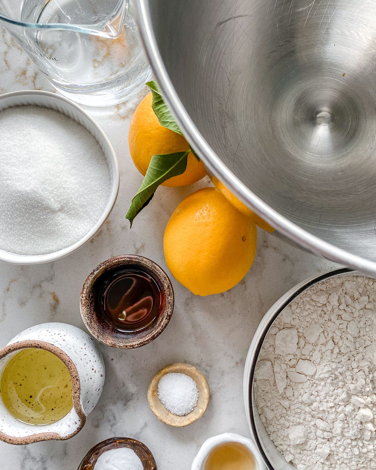 ingredients for Lemon Frosting Cake measured out against a white surface