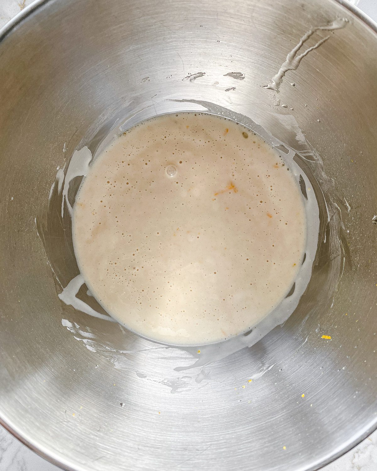 process showing post mixing of Lemon Frosting Cake batter in stainless steel bowl