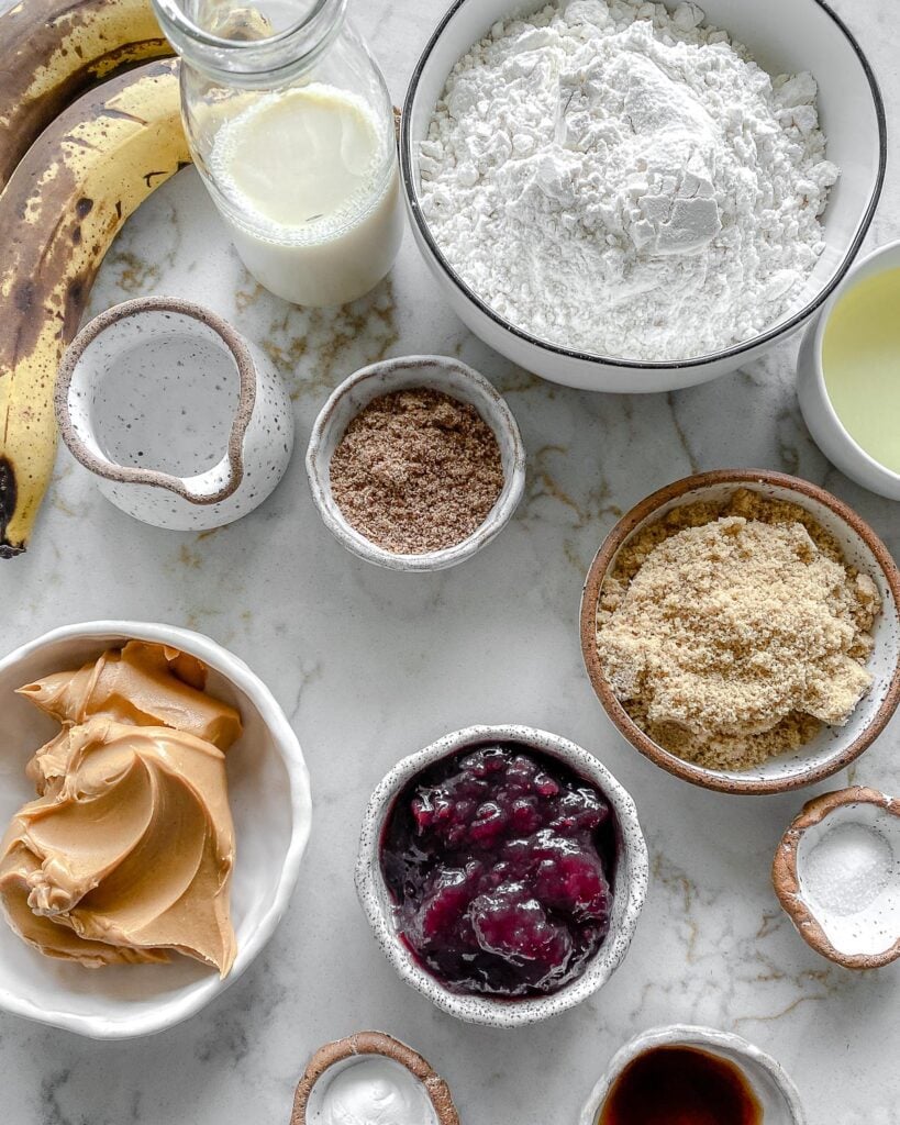 measured out ingredients for Peanut Butter and Jelly Blondie Bars on a white surface