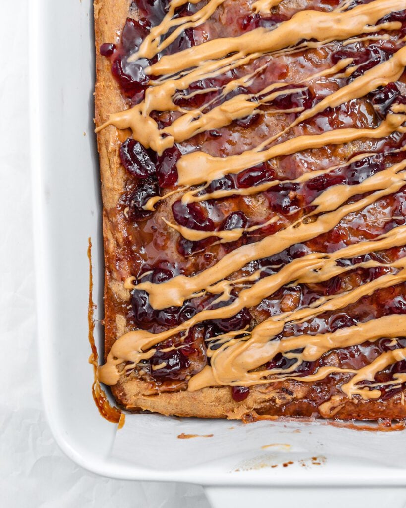 completed Peanut Butter and Jelly Blondie Bars on a white surface