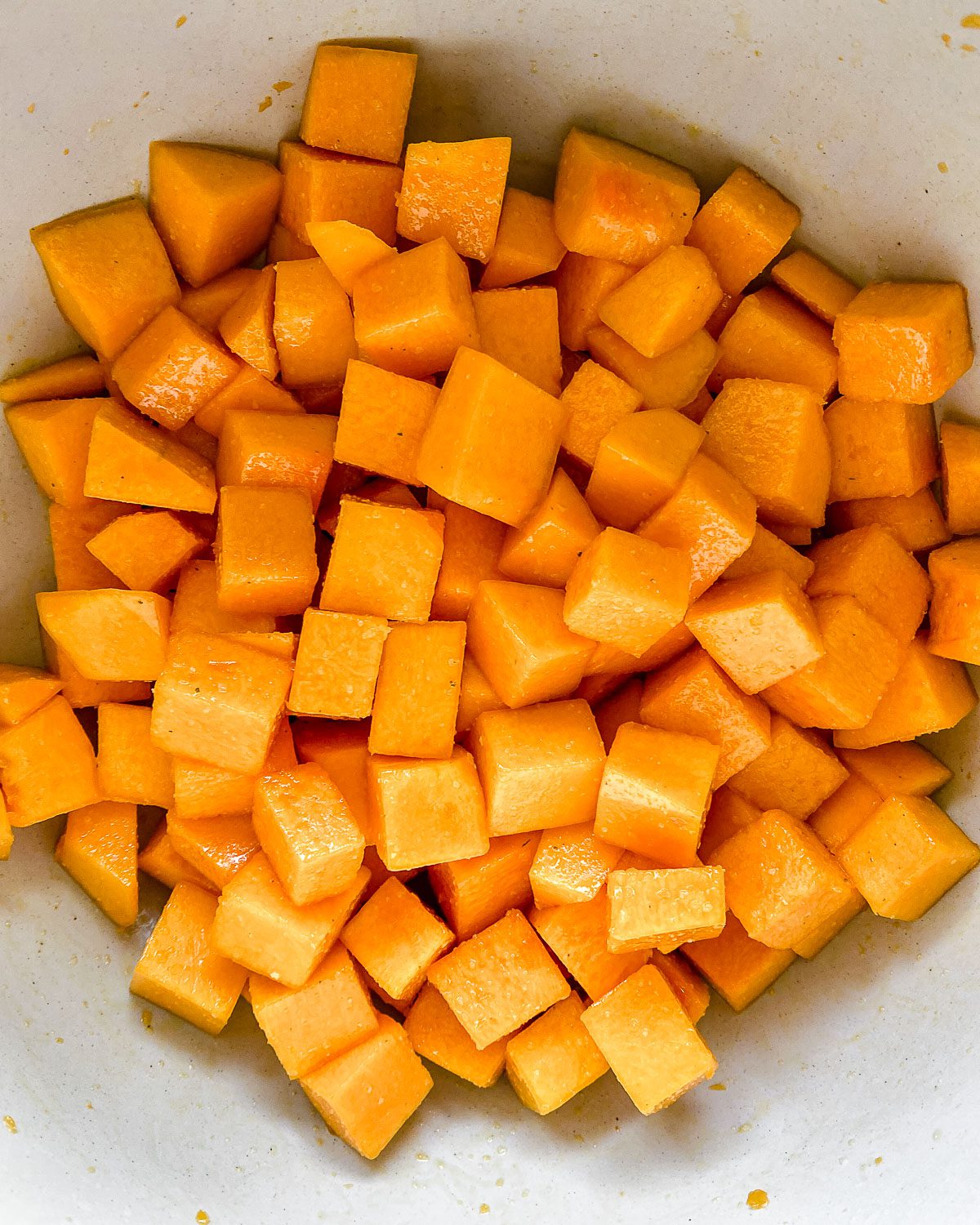 diced butternut squash in a white bowl