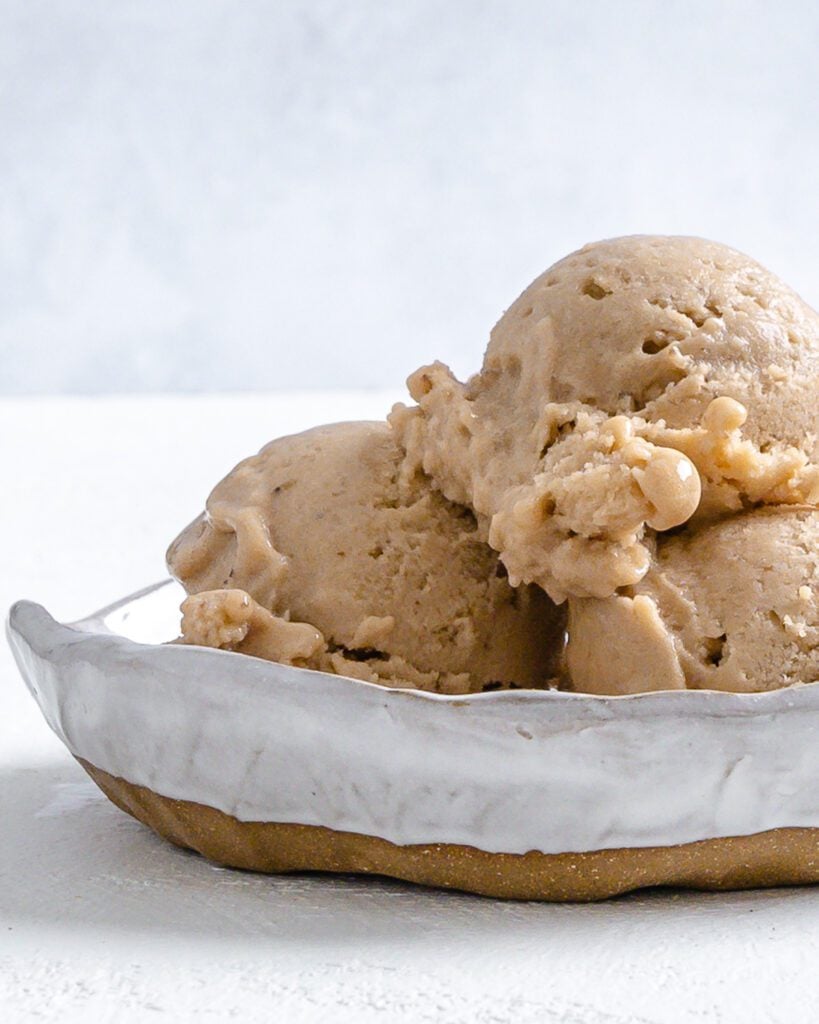 completed coffee banana nice cream in a white bowl against a white background