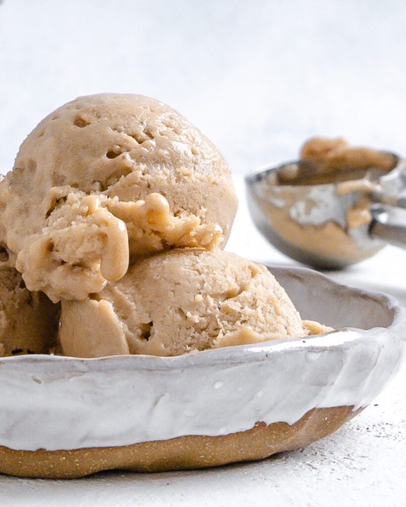 completed coffee banana nice cream in a white bowl against a white background