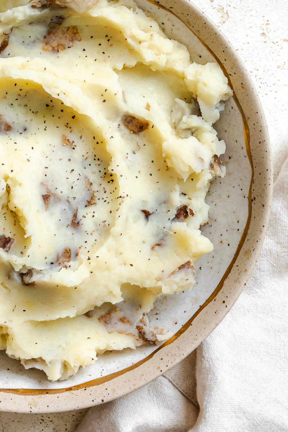Completed Instant Pot Garlic Mashed Potatoes [+ Mix-Ins] in a bowl.