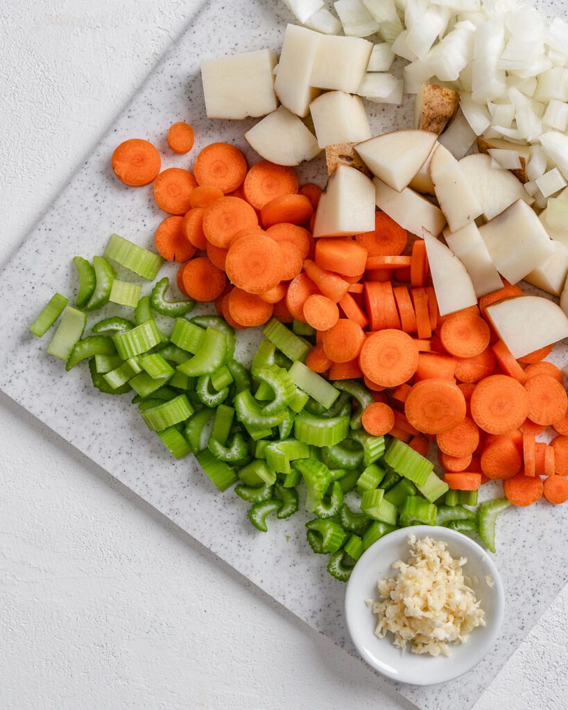 chopped ingredients for Vegan Instant Pot Navy Bean Soup against a white surface