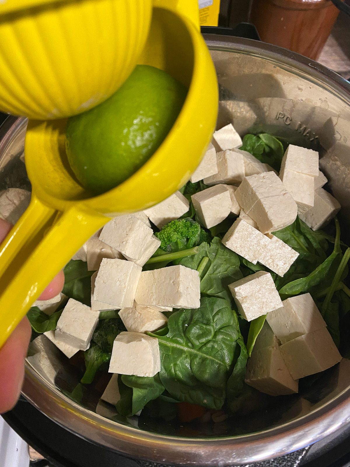 process shot of lime juice being added to instant pot