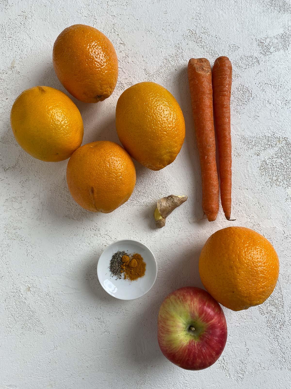 ingredients for Immunity Boosting Juice spread out on a white surface