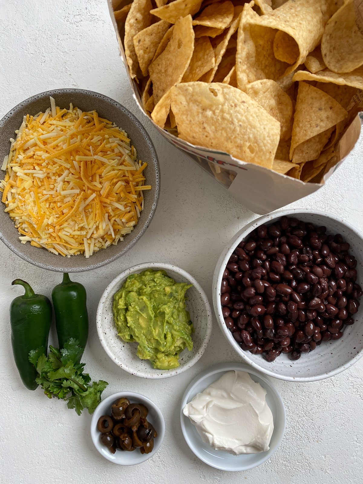 measured out ingredients for Vegan Air Fryer Nachos against white background