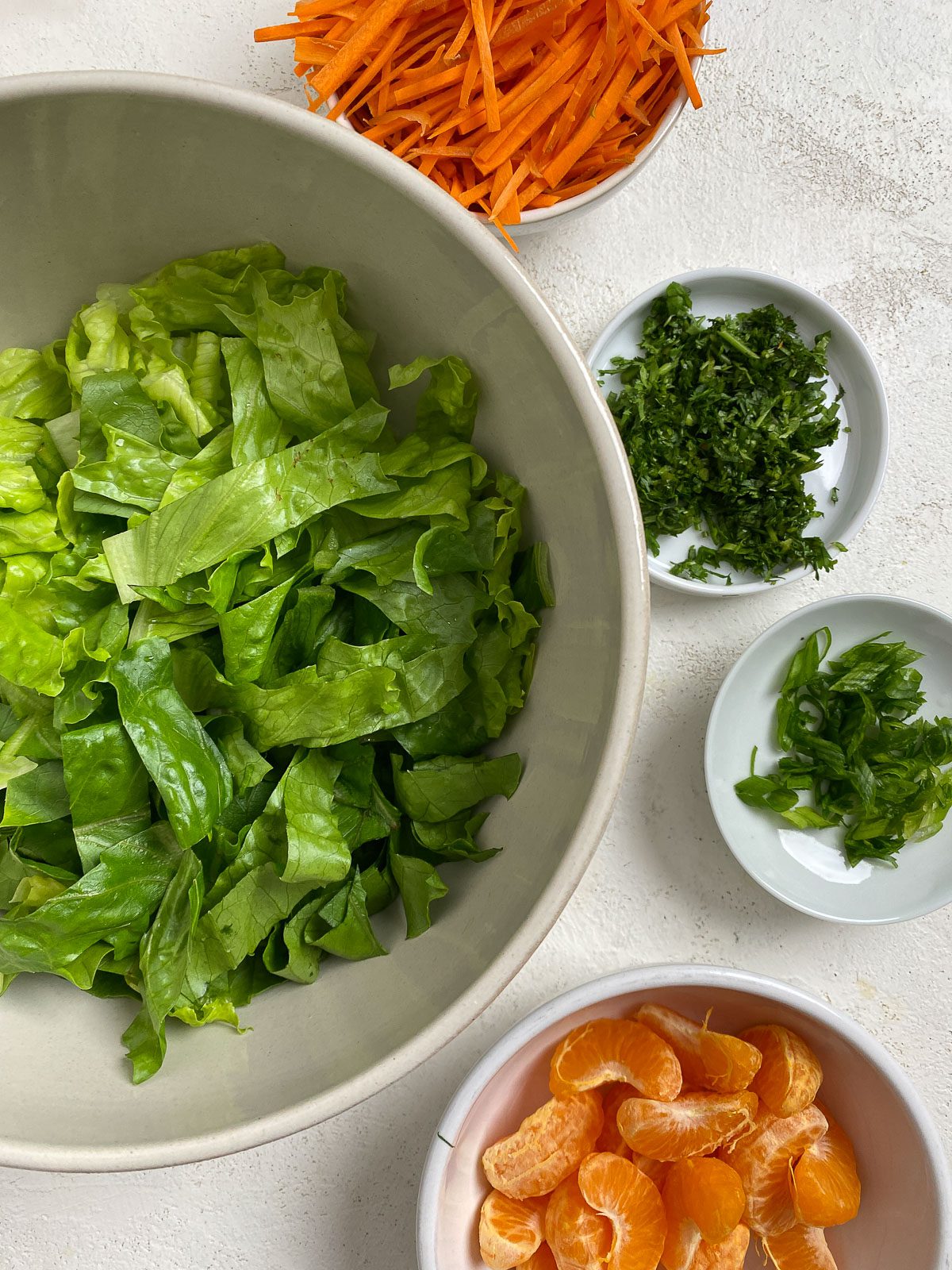 ingredients for Vegan Asian Mandarin Chicken Ramen Noodle Salad measured out against a light surface
