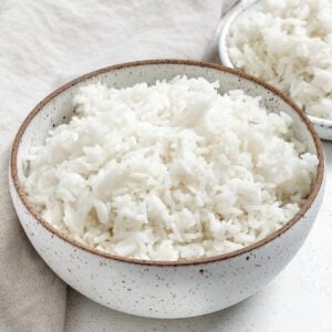 completed Instant Pot Basmati Rice in a white bowl against a light background