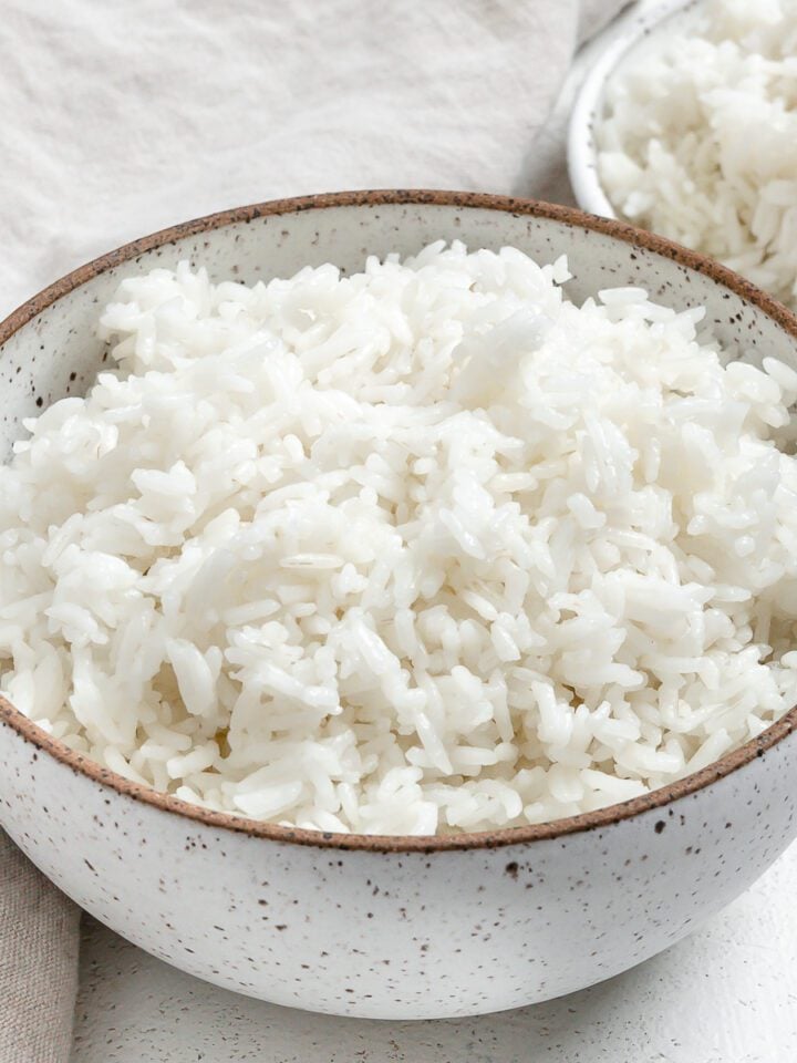completed Instant Pot Basmati Rice in a white bowl against a light background