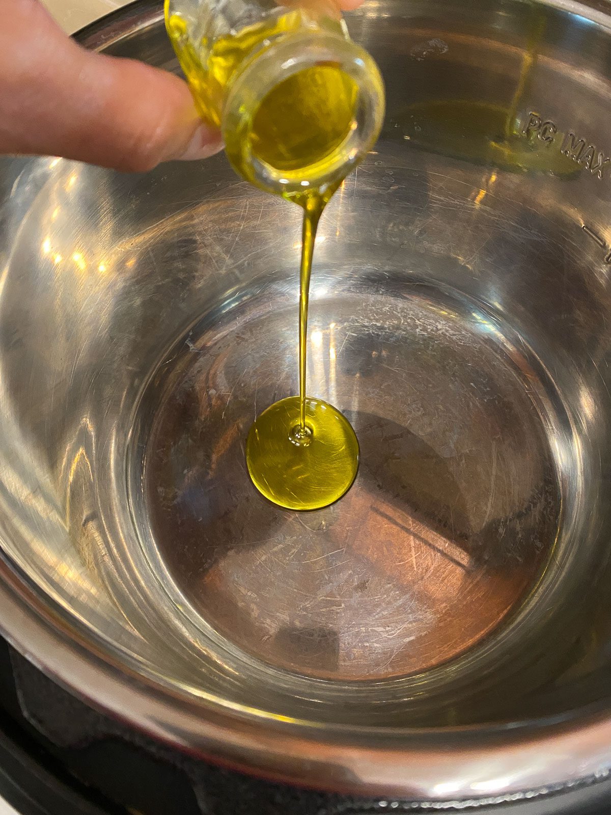 process of adding oil to pan