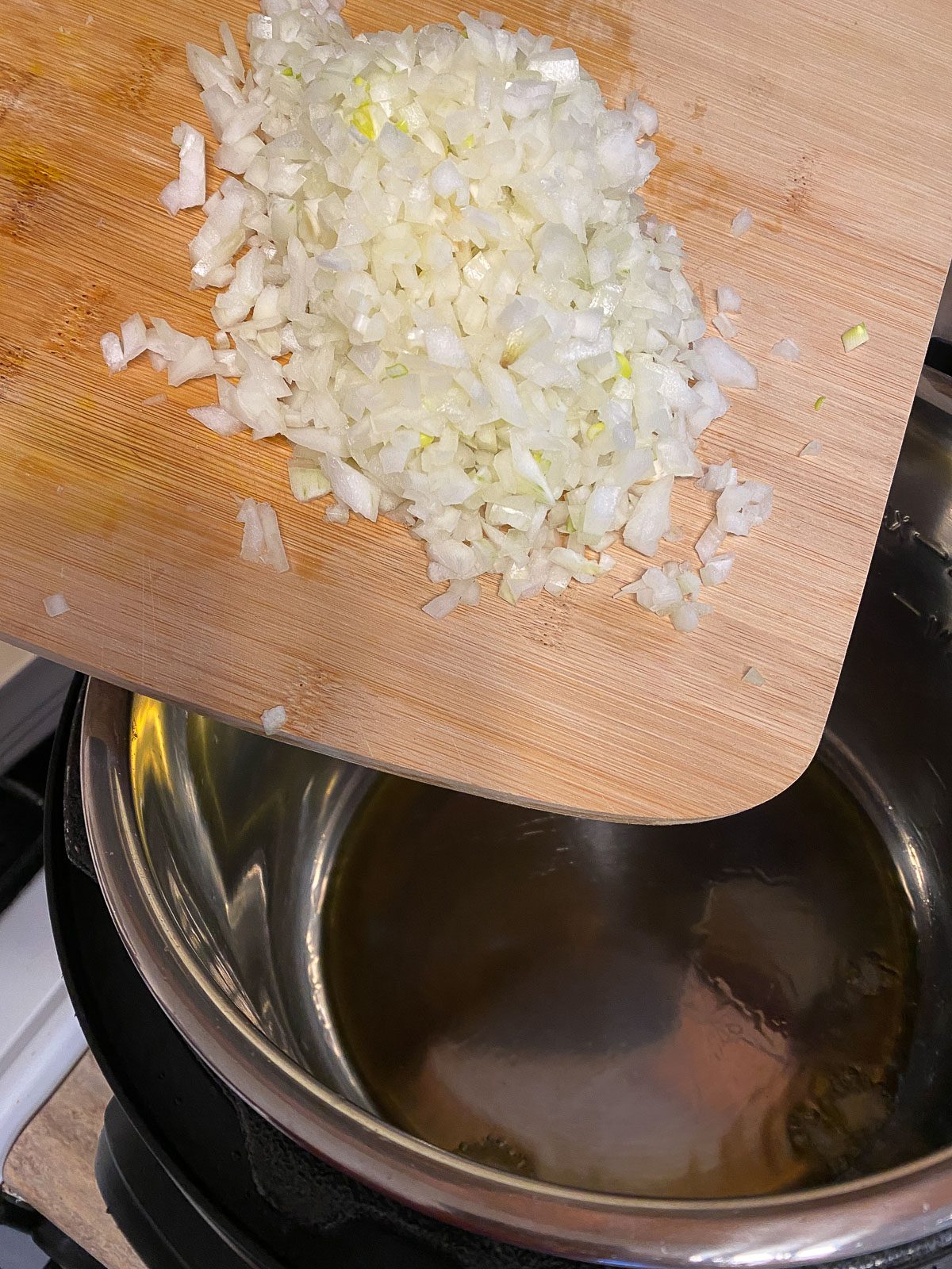 process of adding garlic to pot