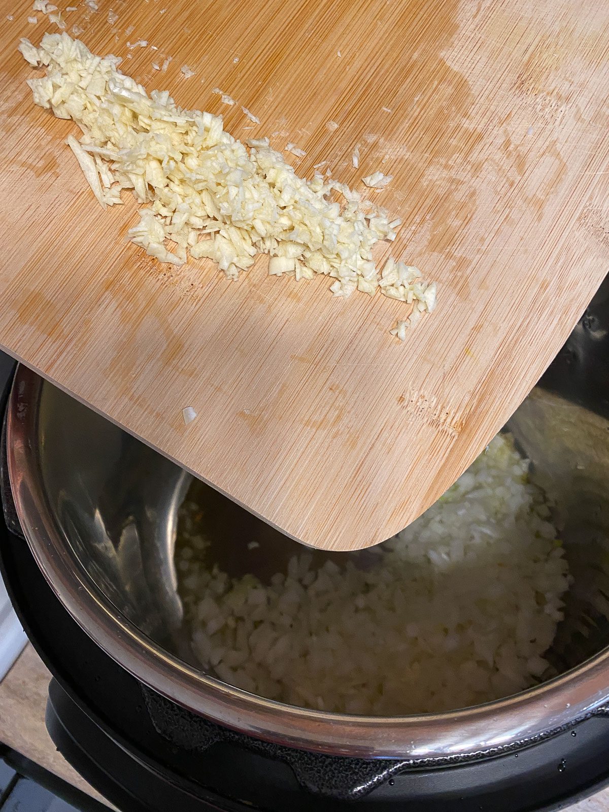 process of adding onion to pot