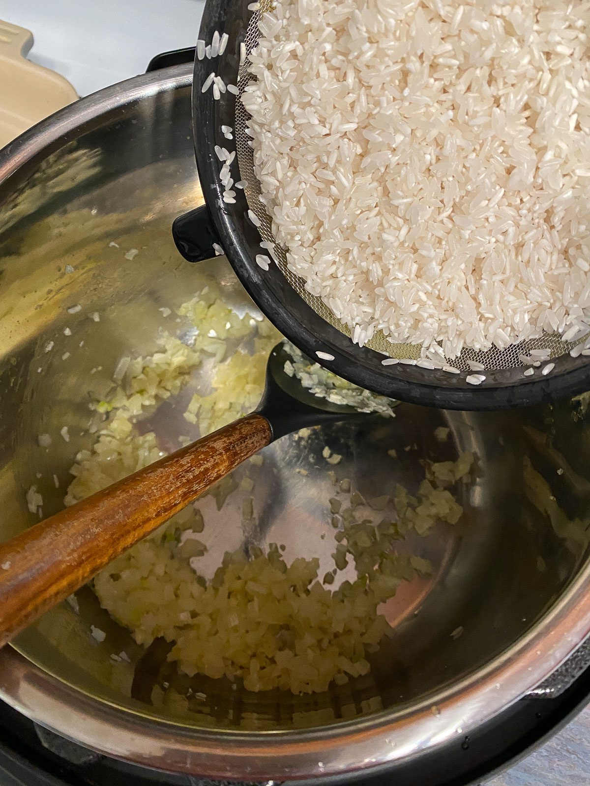 process of adding rice to pot