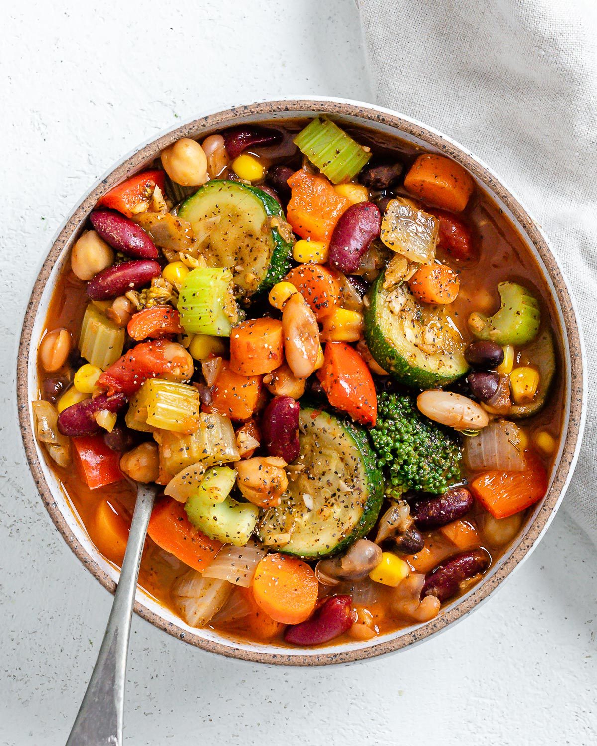 completed vegetable stew in a white bowl against a white surface