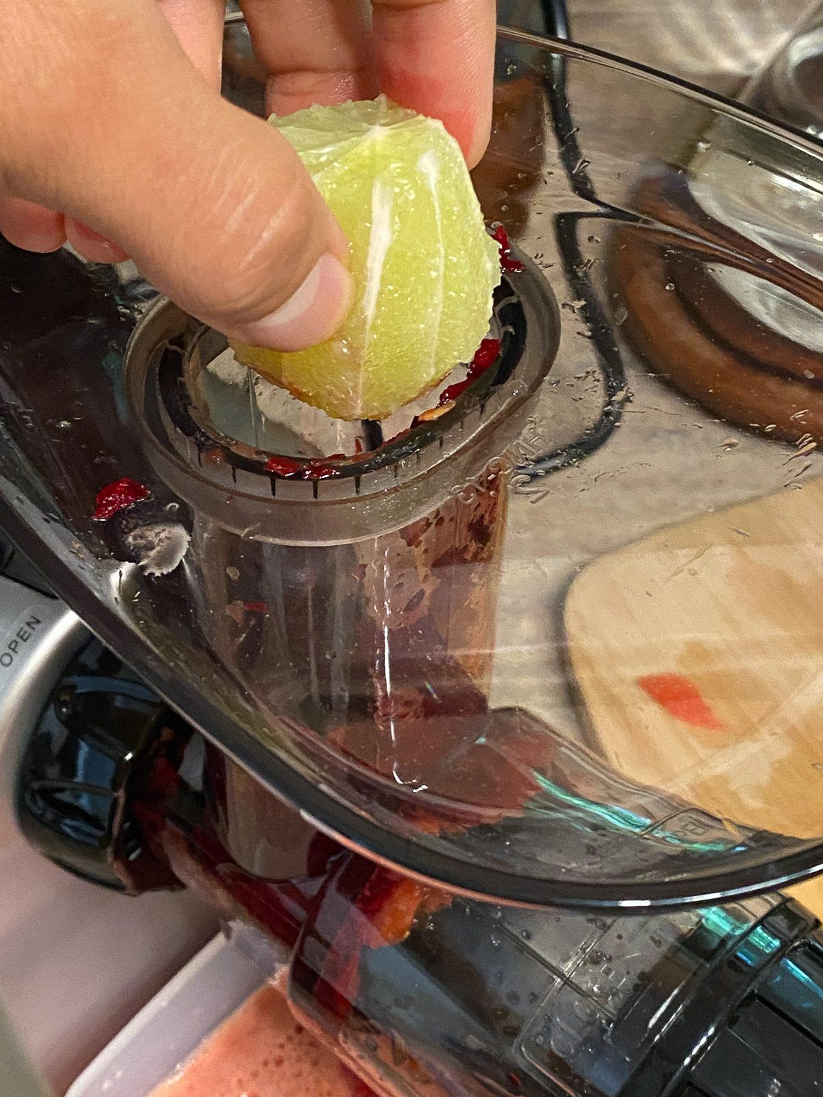 process shot adding lime to juicer