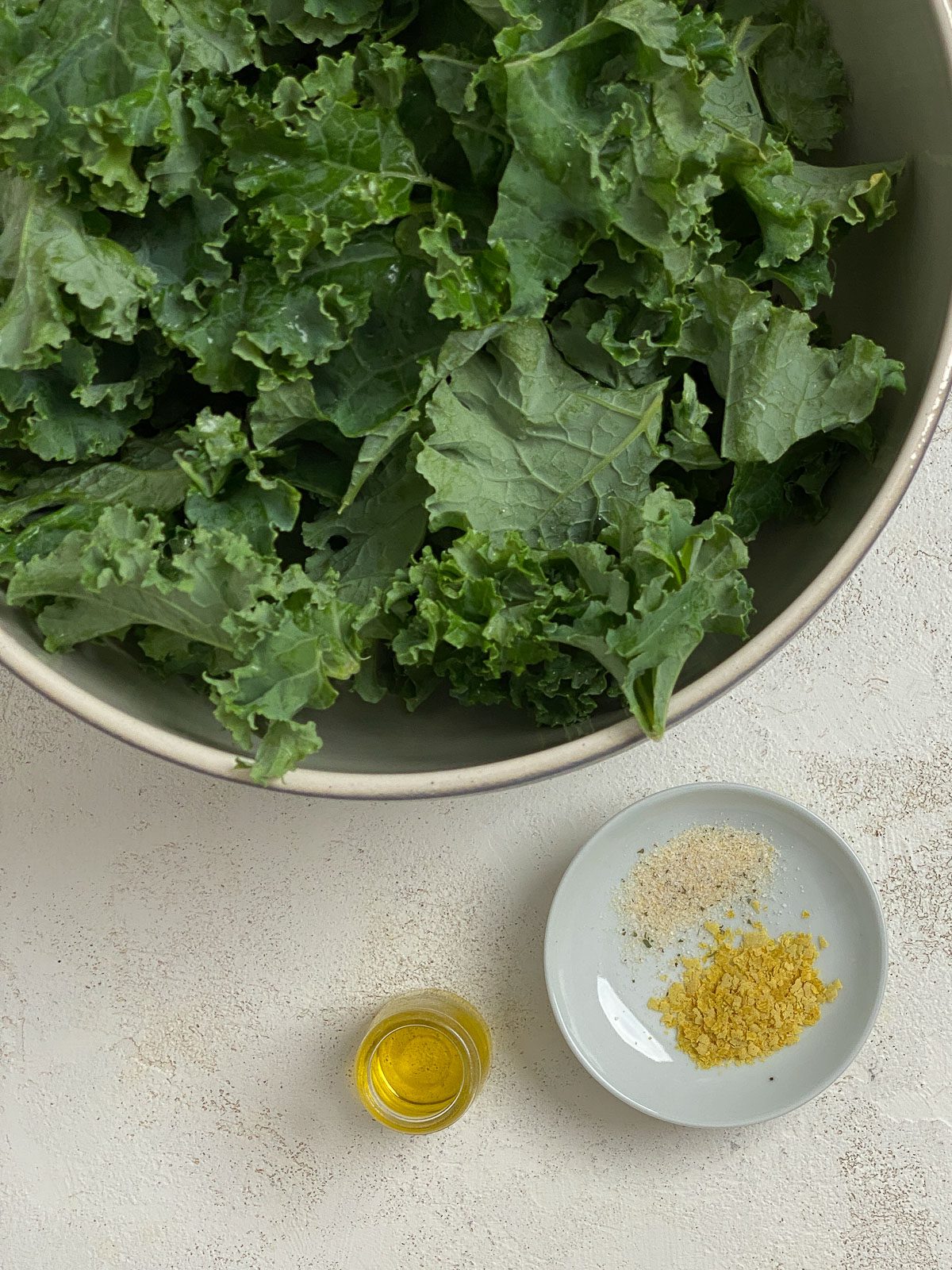 ingredients for Air Fryer Kale Chips in individual bowls