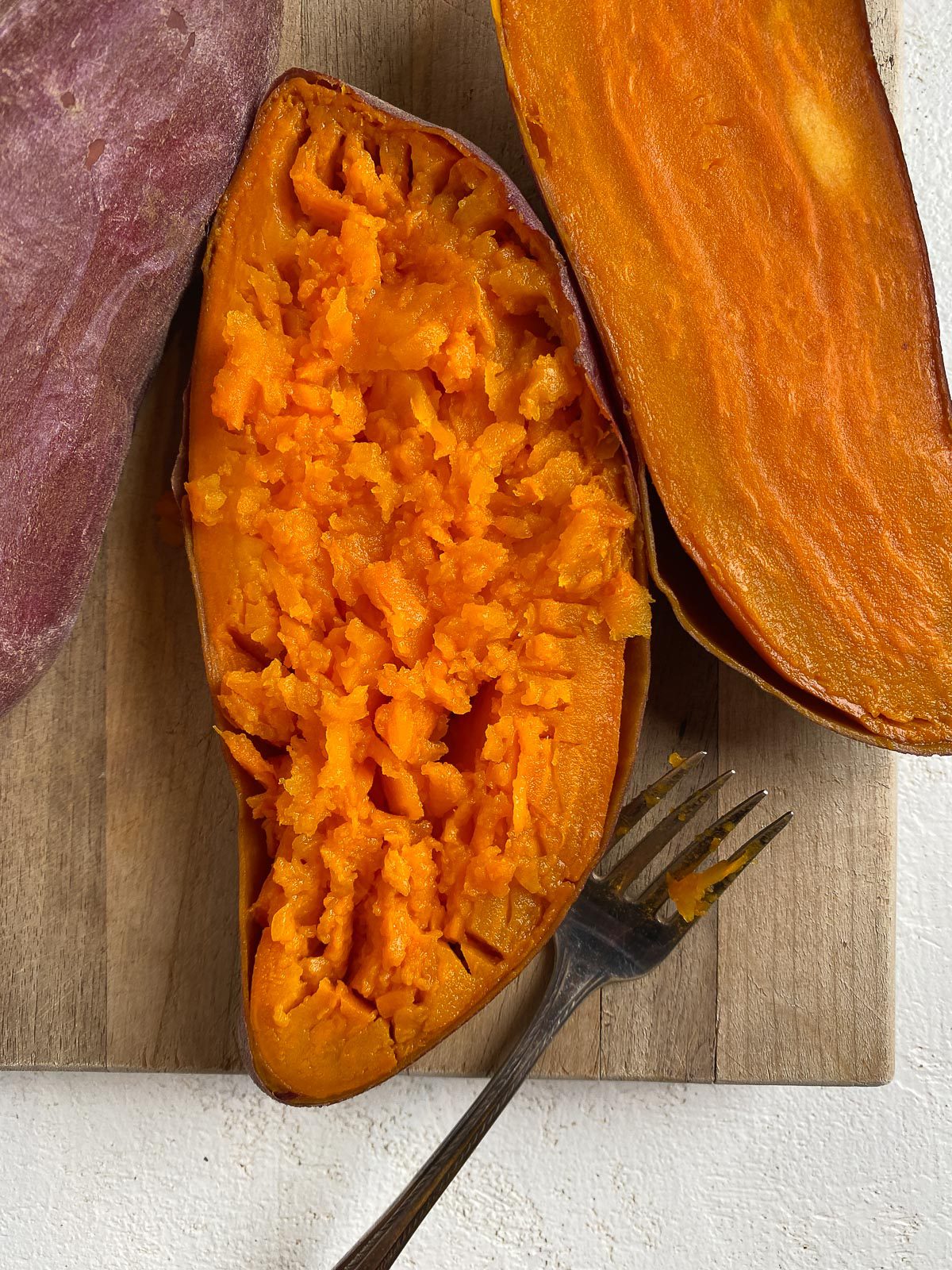 halved sweet potato on a cutting board