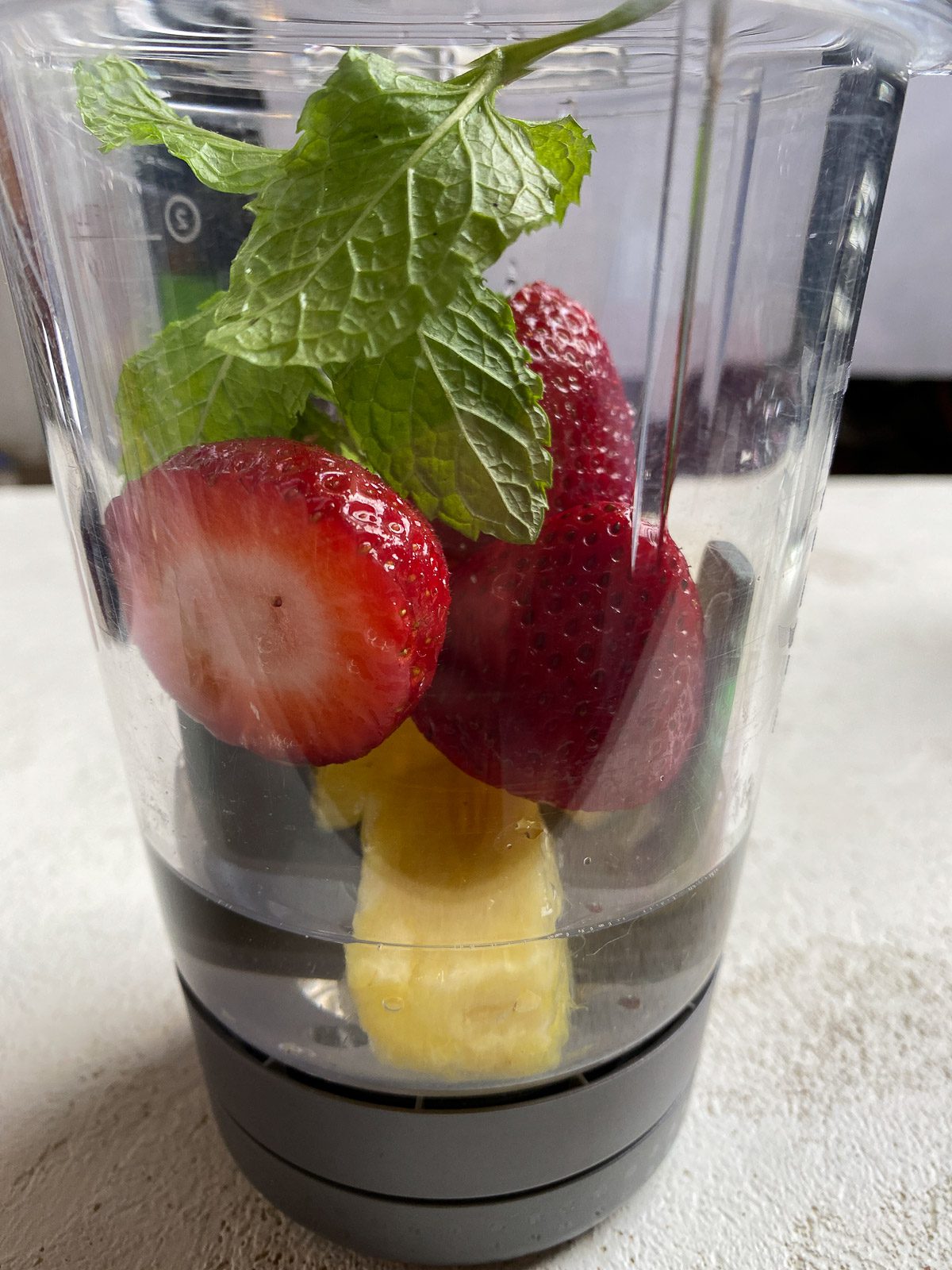 ingredients for Strawberry Pineapple Mocktail added to blender