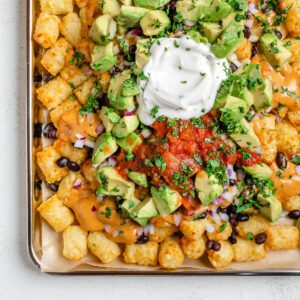 completed Totchos on a tray against a white surface