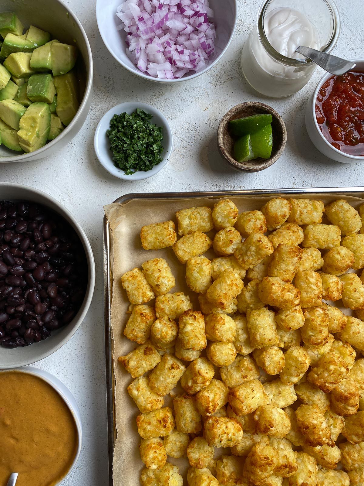 ingredients for Totchos measured out on a white surface