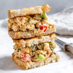 completed Vegan Chickpea Salad Sandwich on a white surface
