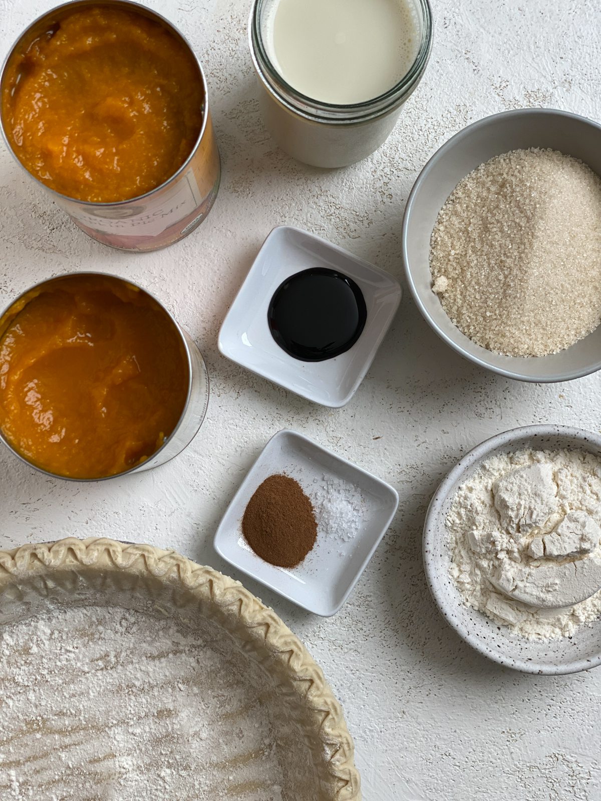 ingredients for Easy Vegan Pumpkin Pie measured out against a white surface