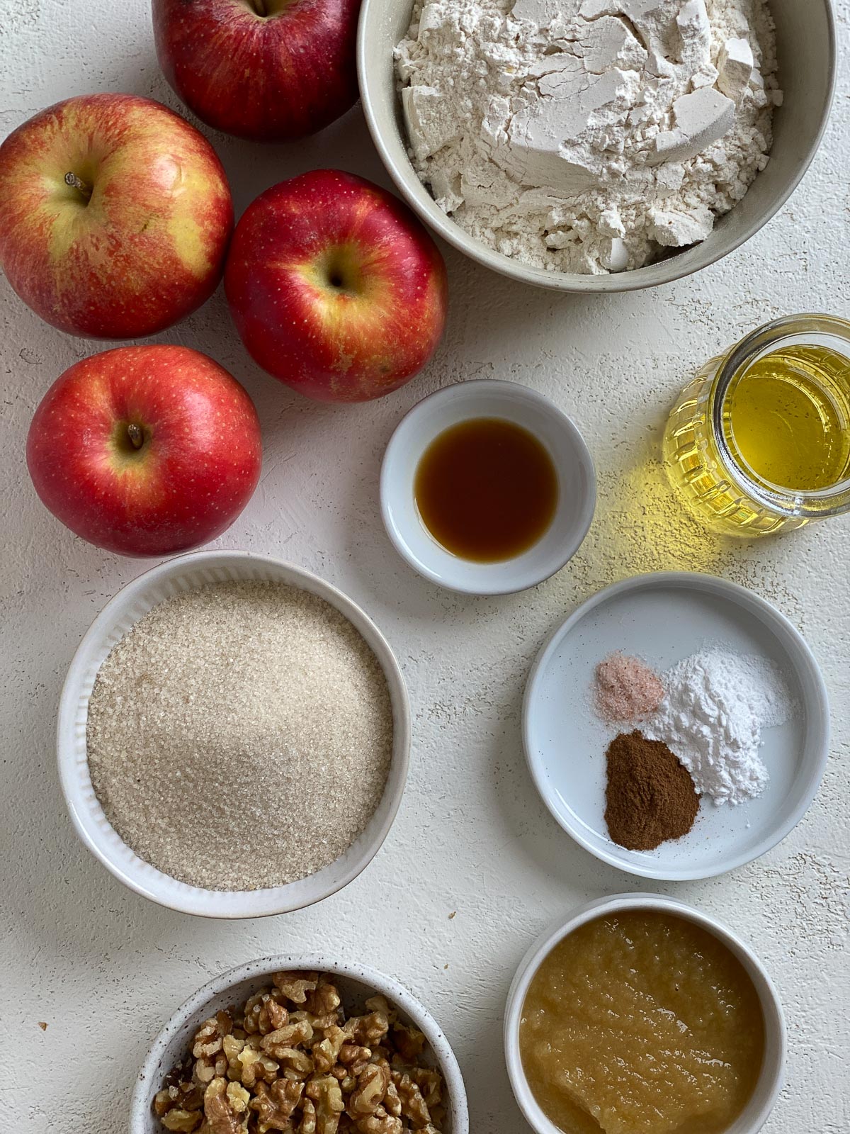ingredients for Vegan Apple Muffins measured out against a white surface