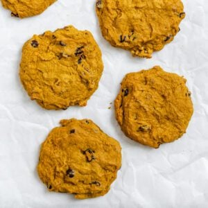 completed Soft Gluten-Free Pumpkin Cookies scattered on a white surface