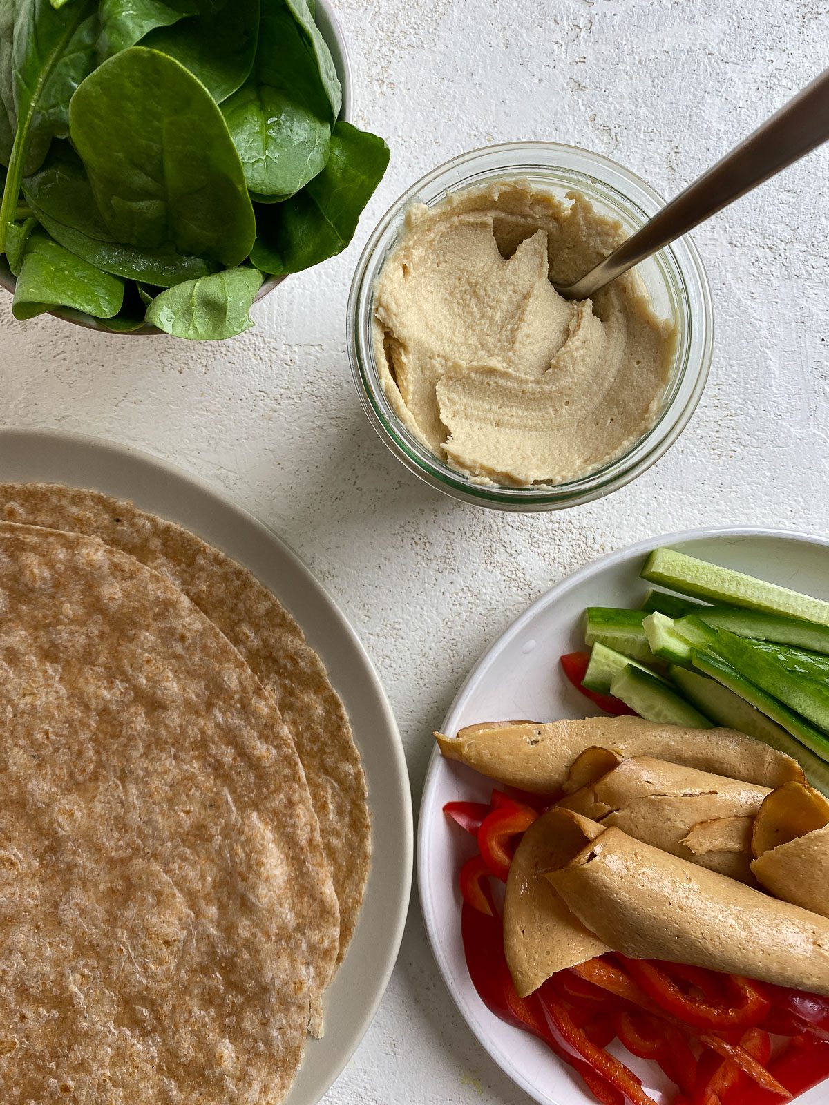 ingredients for Vegan Hummus Wrap against a light surface