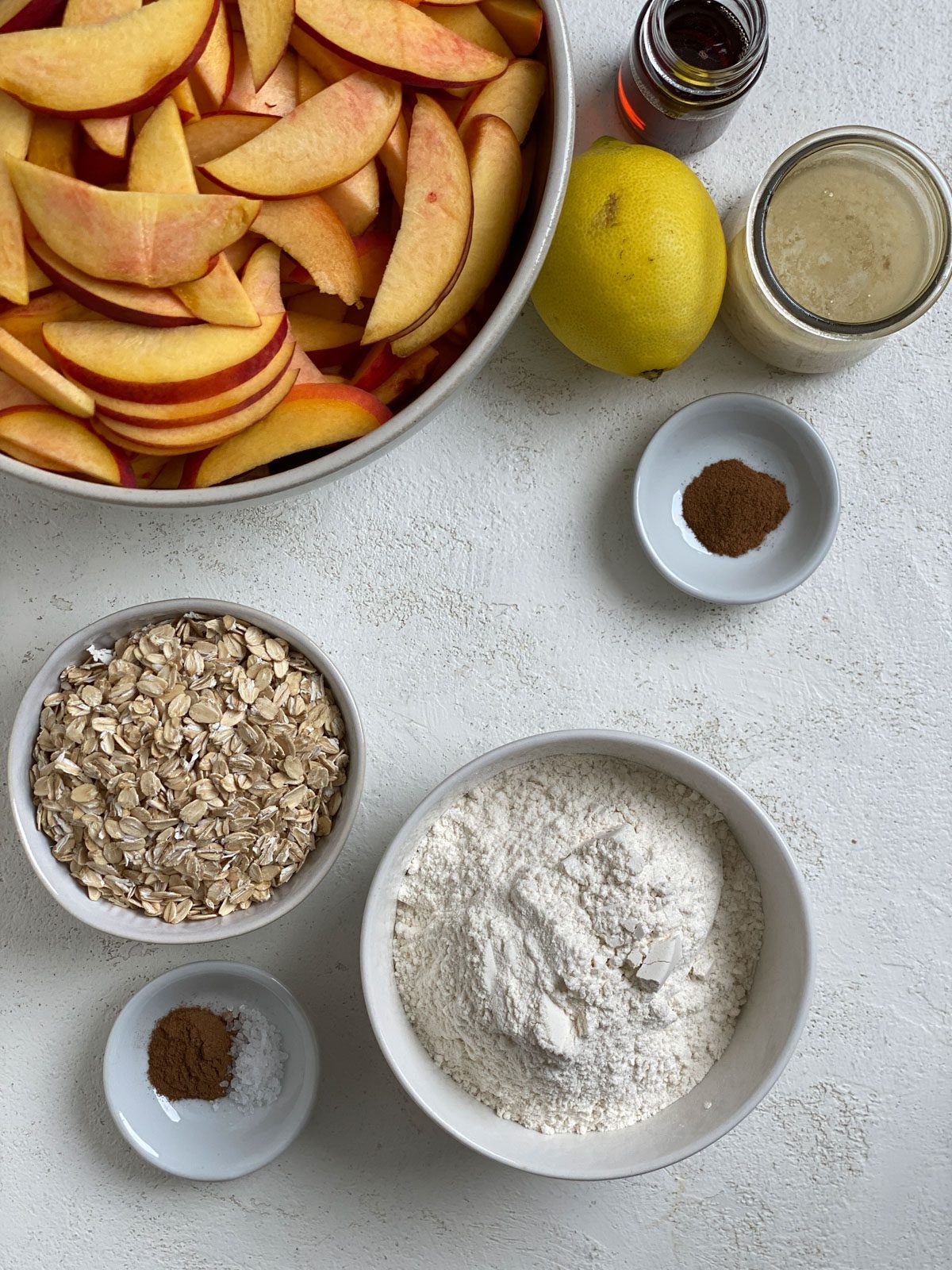 ingredients for Vegan Peach Crisp measured out against a white background