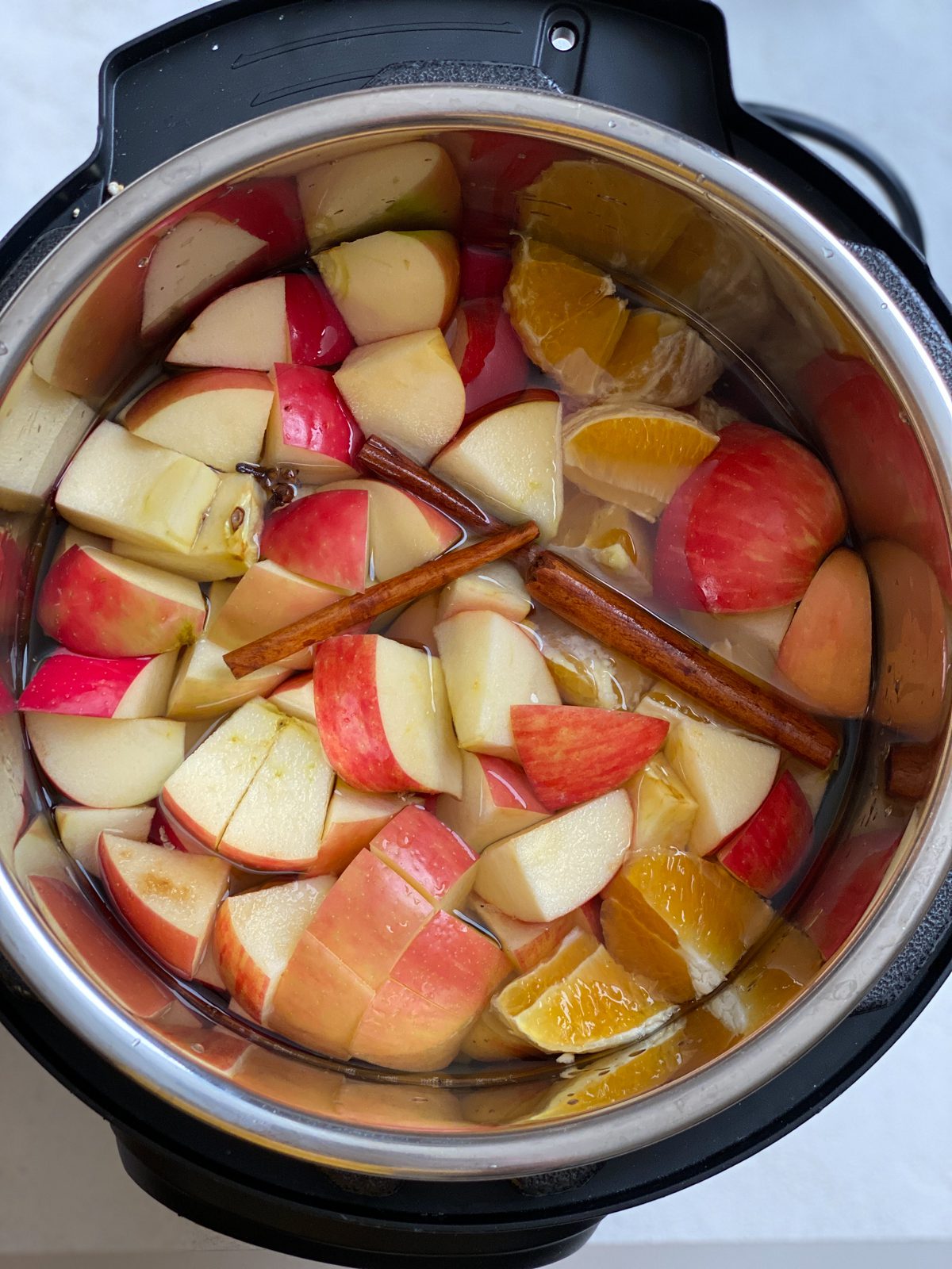 all ingredients for Vegan Instant Pot Apple Cider in an instant pot