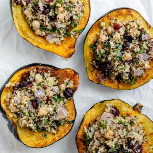 completed Vegan Stuffed Acorn Squash [With Quinoa] on a white dish