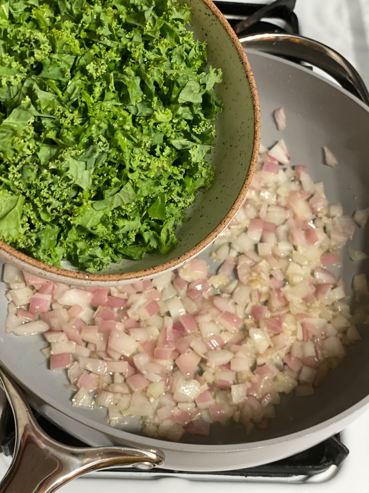 process of adding kale to pan