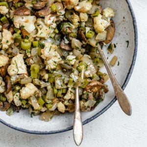 completed Vegan Cauliflower Stuffing in a bowl against a light background