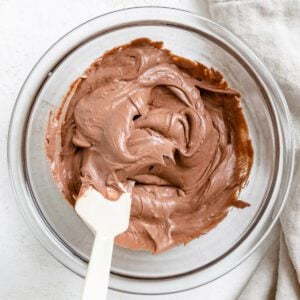completed Vegan Chocolate Frosting in a bowl against a white background