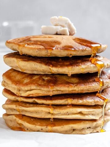 completed stack of Vegan Pumpkin Pancakes against a white background