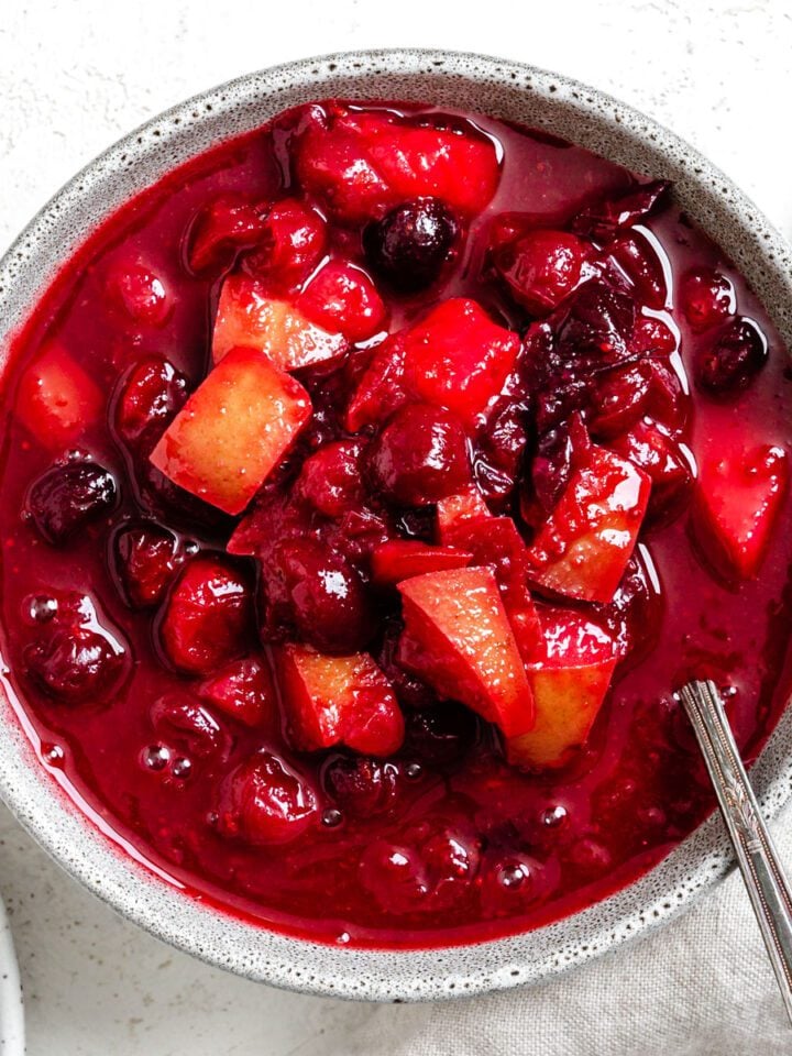 completed Easy Cranberry Pear Sauce in a bowl against a white surface