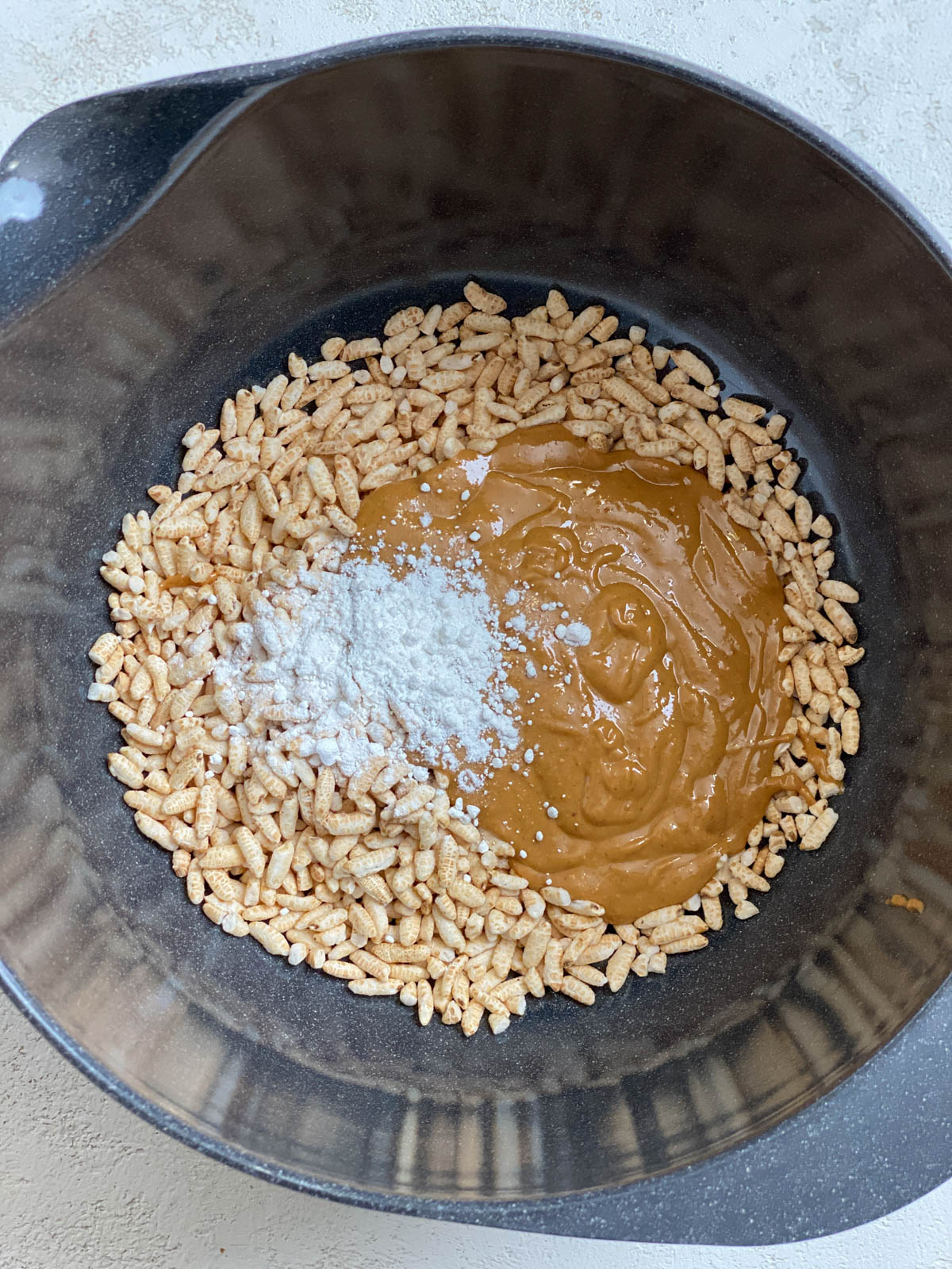 process shot of mixing ingredients together in a bowl