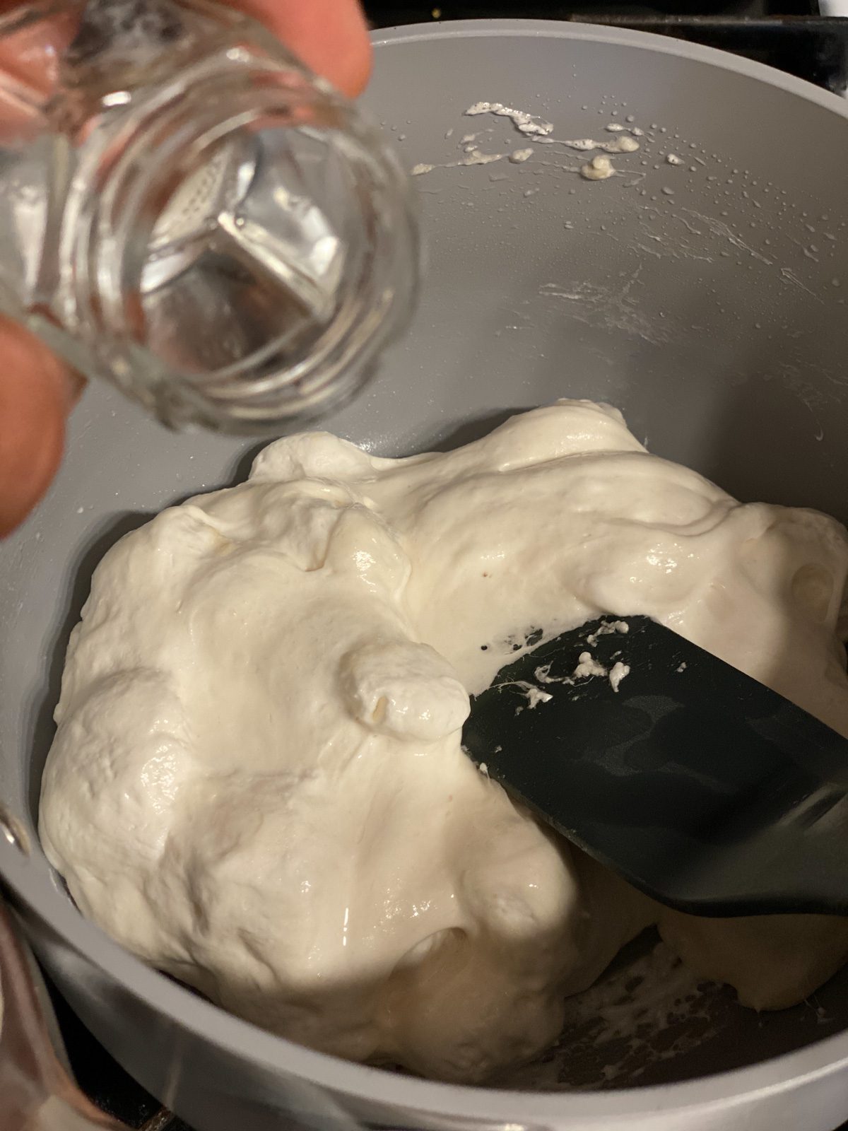 process shot of adding water to pan