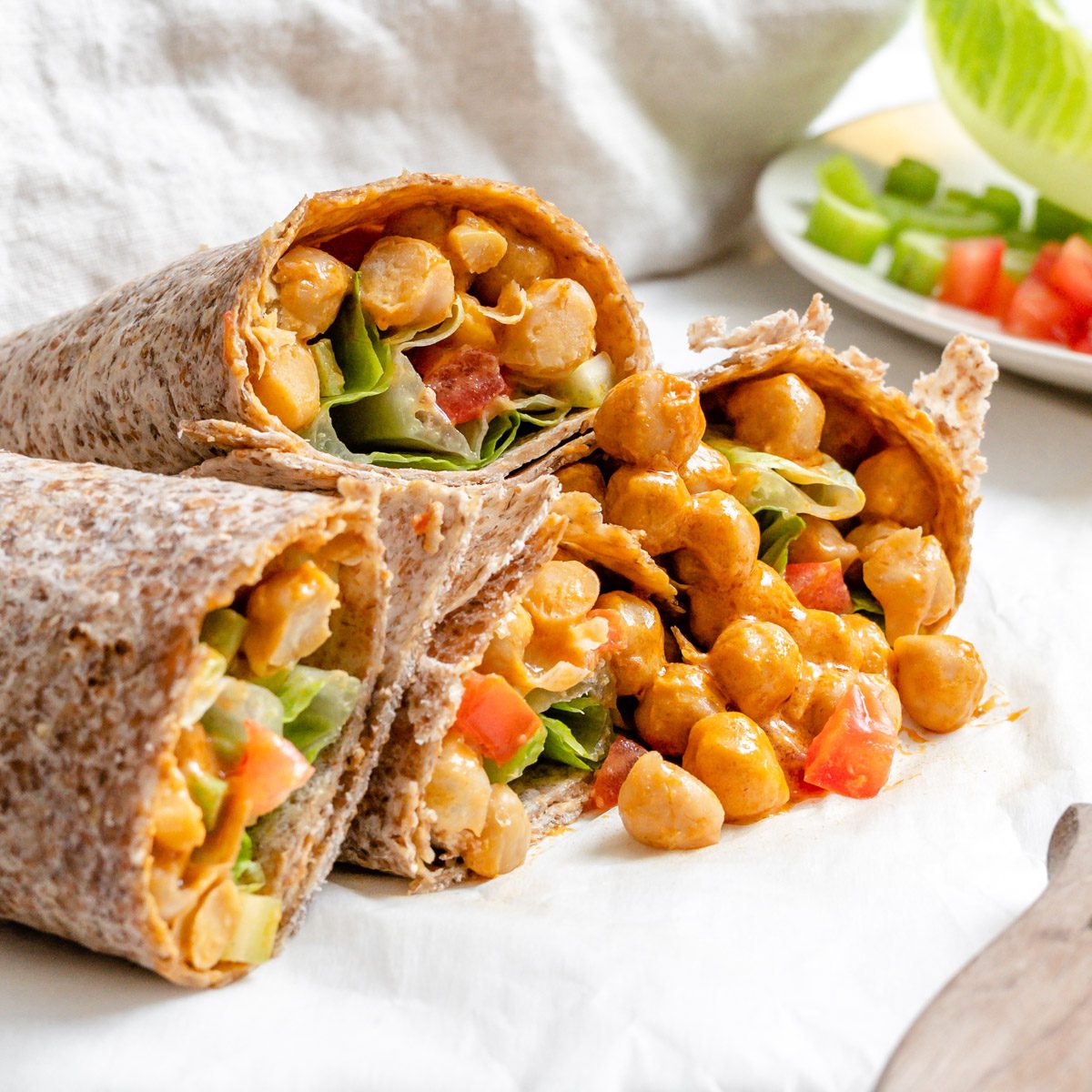 https://foodsharingvegan.com/wp-content/uploads/2022/11/Buffalo-Chickpea-Wrap-Plant-Based-on-a-Budget-1-2.jpg