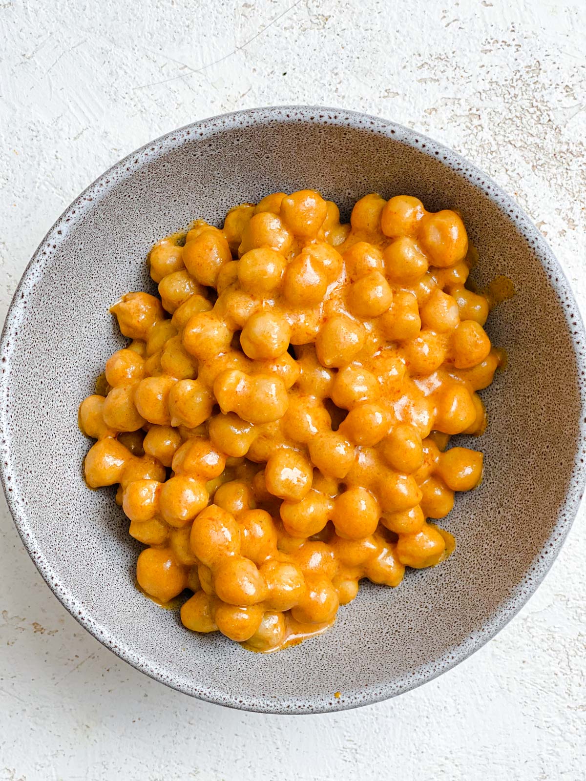 post mixing of chickpeas and buffalo sauce together in bowl