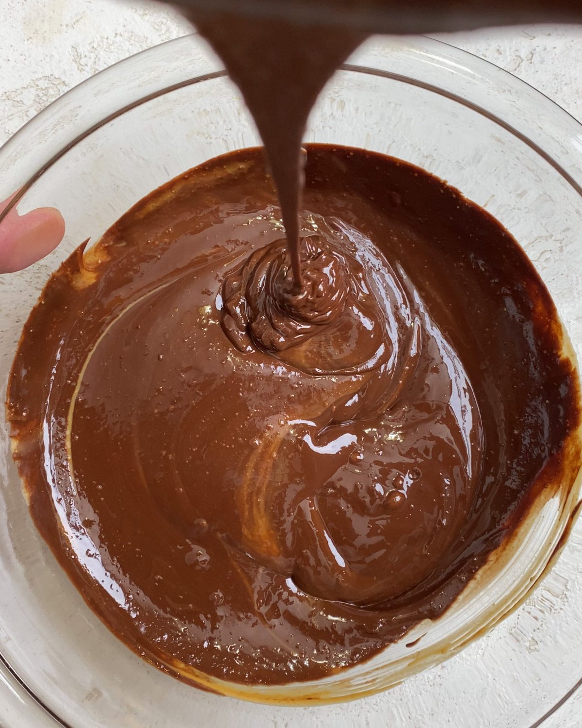 process shot of completed mixing of chocolate and peanut butter together in bowl