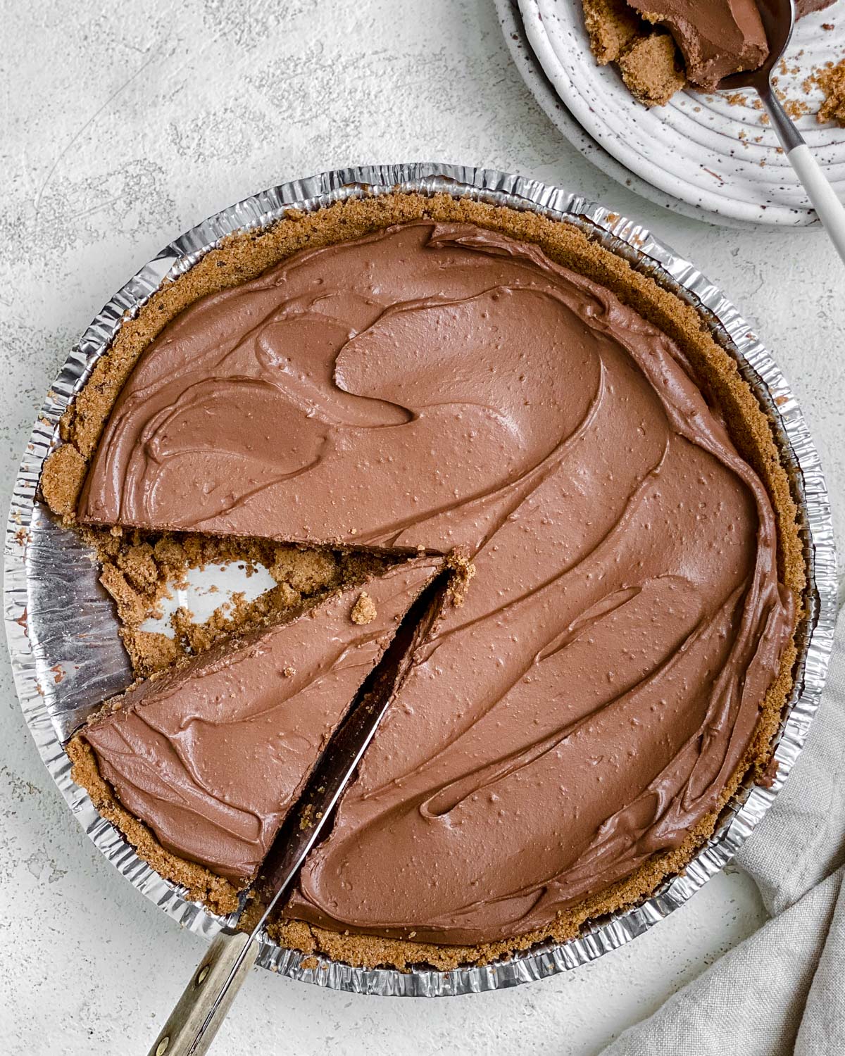 completed Easy Vegan Chocolate Peanut Butter Pie with a slice cut out